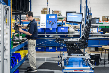 A worker assembles seats in RCO aerospaces production manufacturing facility. 