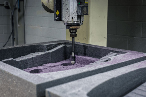 A CNC machine working on a molded foam prototype