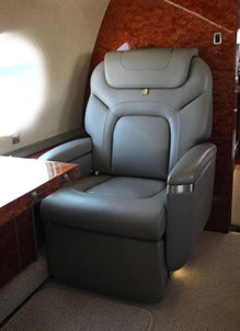 A leather appointed aerospace seat for a business jet made by aerospace manufacturing services